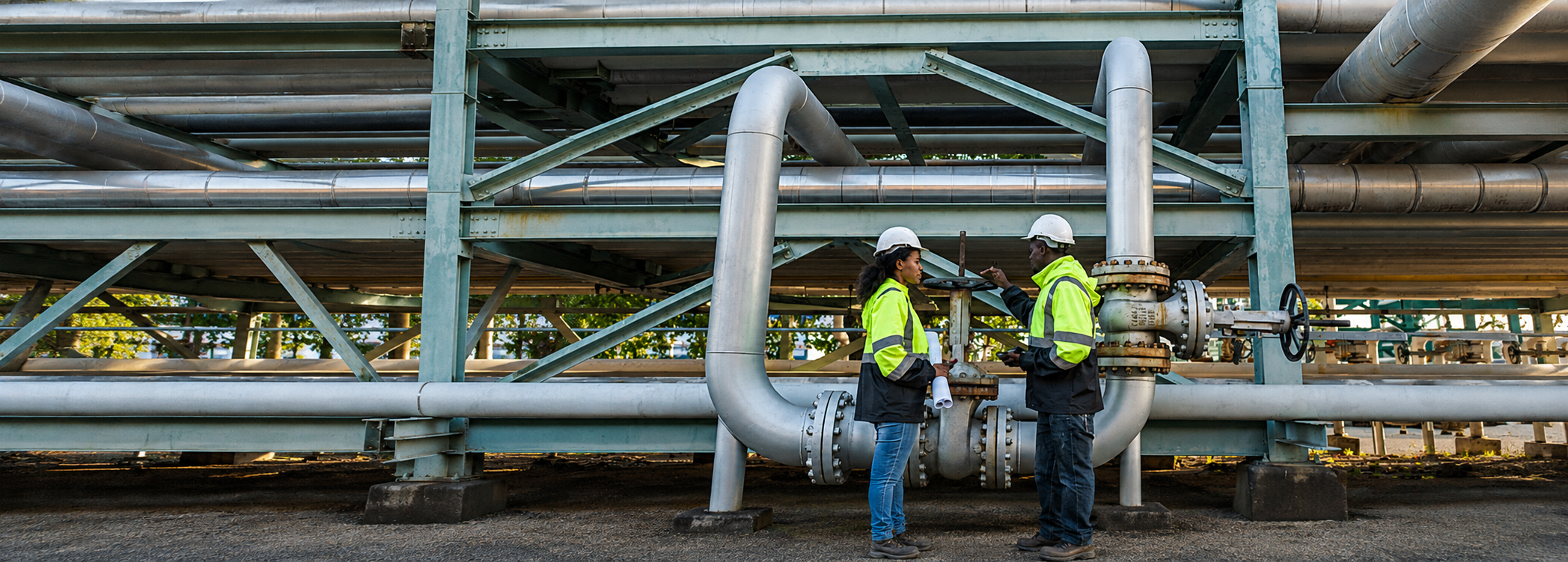 Petroleum engineers reviewing technical data